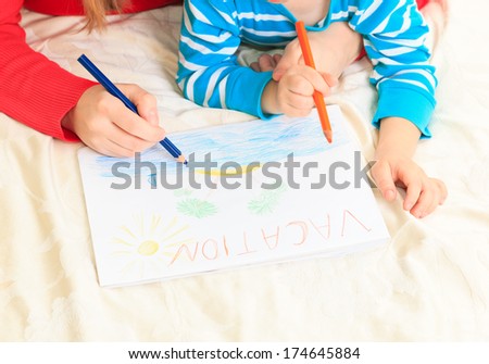 mother and son drawing vacation, family vacation concept