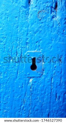 Blue door texture with keyhole.