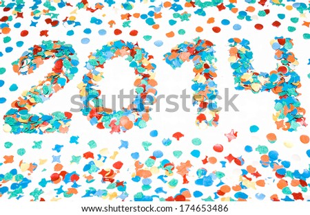 2014 carnival date in perspective with garnish made with recycled paper colorful confetti isolated white