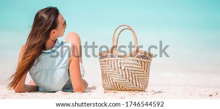Young beautiful woman relaxing on the beach