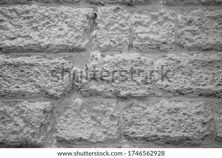 Grey background. Brick wall painted in grey. Grey brick background