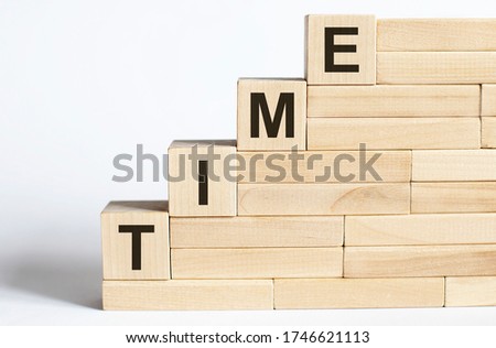 Work strategy on the wood blocks TIME on the white background