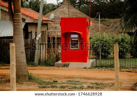 
An ATM in a poor Ghanaian village - (controversial picture shows the social differences between poor and rich people) Accra, Ghana