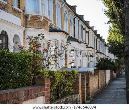 colorful and aligned houses. Roding road, Hackney district in London Royalty-Free Stock Photo #1746646094