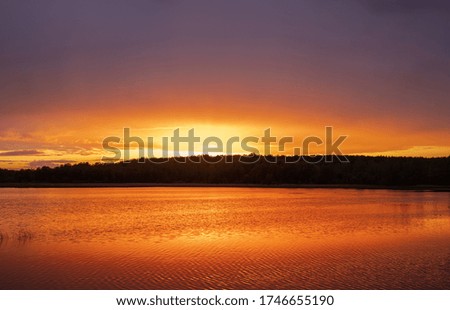 Beautiful Sunset and Reflection on the Lake in Lithuania