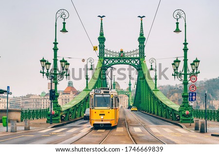 Liberty Bridge (Freedom Bridge) in Budapest across the Danube River. Historic tram on the bridge. Royalty-Free Stock Photo #1746669839