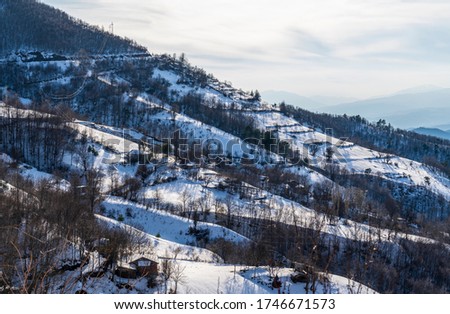 Snowy mountain ridge, chalet, mountain road