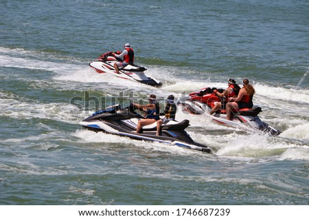 Group of jet skiers on the Florida Intra-Coastal Waterway off Miami Beach.