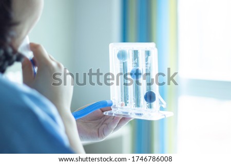 incentive spirometer inhalation exercise pulmonary alveoli restore breath training lung capacity physical therapy covid19 Royalty-Free Stock Photo #1746786008