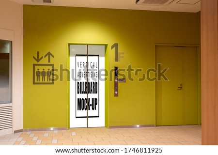 Mock up vertical blank billboard with clipping path on elevator door at modern building, advertising on entrance for transportation at first floor. empty space for insert advertisement indoor poster.