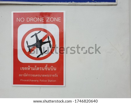 Warning signs the area does not use drones to fly. thai language in the picture means : no drone zone by phraratchawang police station