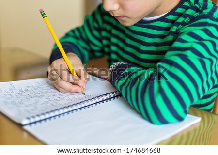 a child writing cursive Royalty-Free Stock Photo #174684668