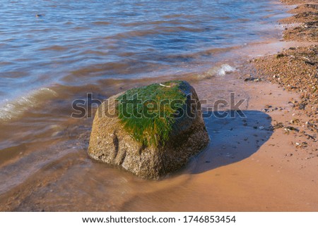City Tuja, Latvia. Baltic sea with rocks and sunshine. Travel photo.10.05.2020