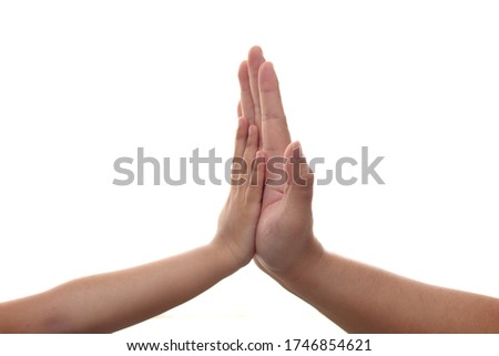 Close up of little kid and adults hand gesture, shows high five. Isolated on white background 