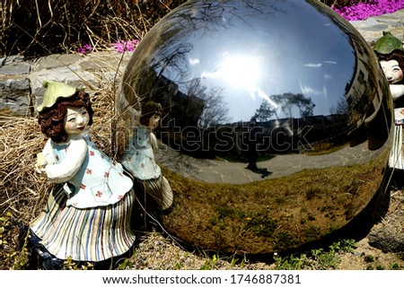 The park has dolls and glass balls and takes selfies.                    
