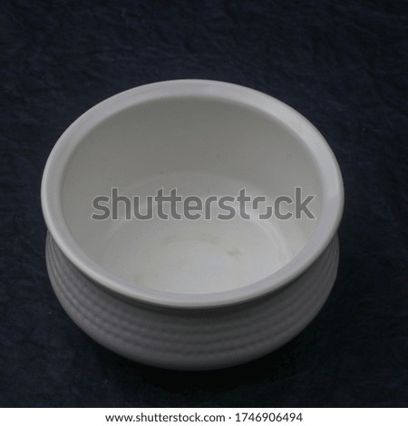 White ceramic plate on blue background