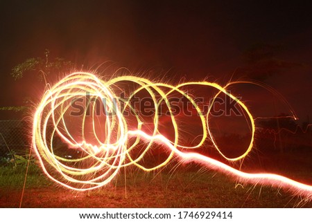 Long exposure photography with dark background.