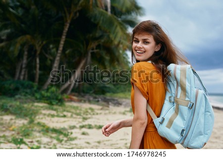 Woman hiker backpack travel vacation walk beach