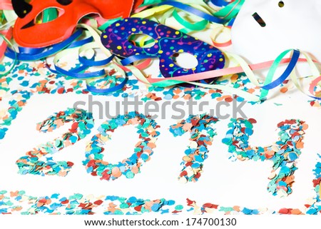 2014 carnival object, streamers, masks and confetti in white background close up