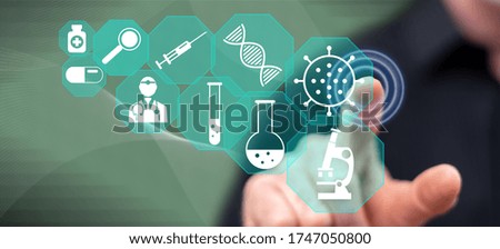 Man touching a medical research concept on a touch screen with his finger