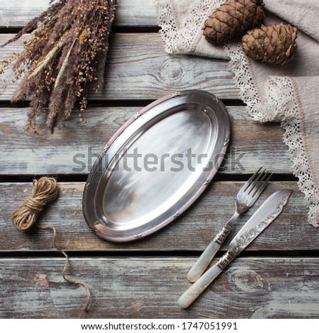 table setting with vintage metal tray on a wooden table