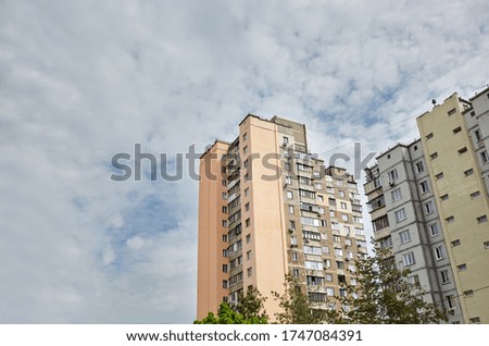 Modern East European residential apartment buildings quarter on a sunny day with a blue sky.Abstract architecture, fragment of modern urban geometry