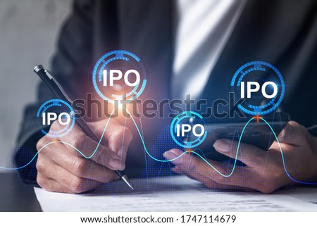 IPO hologram and a woman signing contract use phone. Double exposure. Initial primary offering concept.