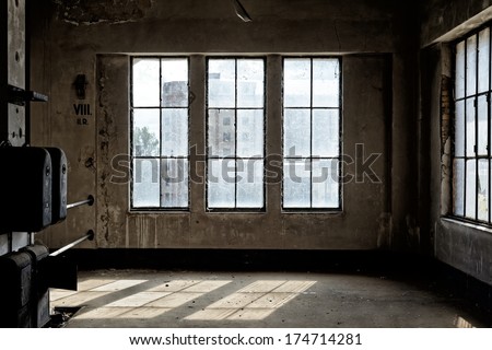 Industrial interior with br light from the windows Royalty-Free Stock Photo #174714281