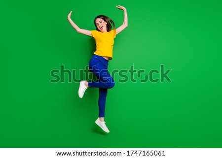 Full length body size view of her she nice attractive lovely dreamy glad careless cheerful cheery girl jumping dancing having fun isolated bright vivid shine vibrant green color background
