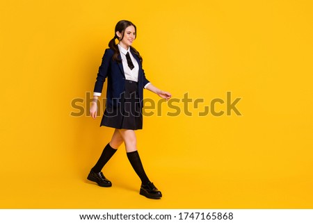 Full body profile side photo of positive university student go walk lecture courses wear good look uniform shoes isolated bright color background