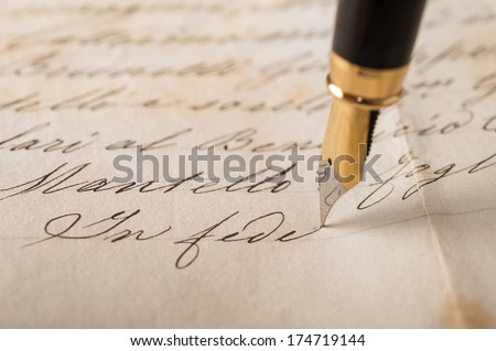 Fountain pen writing on an old handwritten letter Royalty-Free Stock Photo #174719144