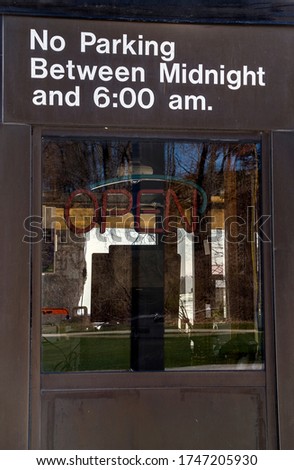An open sign in window