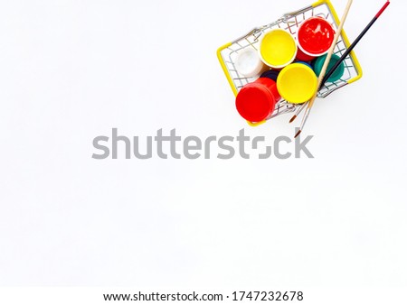 acrylic paints, on a light background for children's creativity in a metal curtain rod