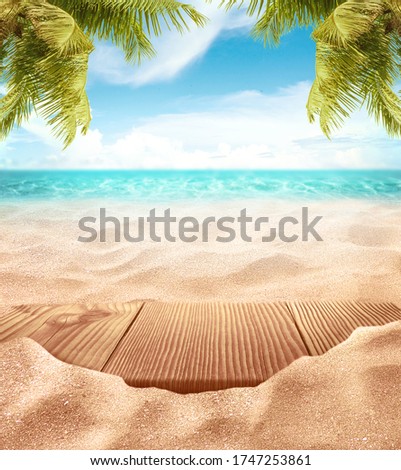 Tropical fine sandy beach with blured sea sun sky clouds background with wooden table top and empty space for product advertisement Montage of summer relaxation background