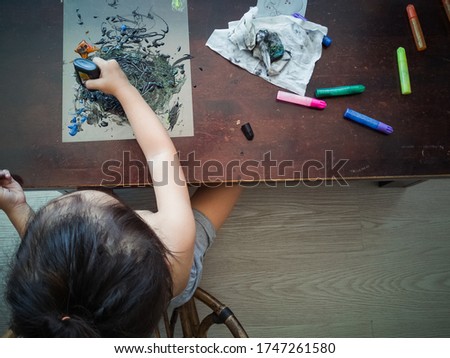 Toddler child painting at home, creative free time