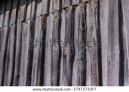 abstract background of old gray boards with a beautiful texture with knots