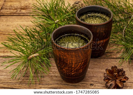 Pine needle tea, sollip-cha, traditional Korean beverage. Alternative medicine, healthy life style. Vintage wooden boards background Royalty-Free Stock Photo #1747285085