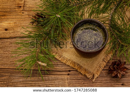 Pine needle tea, sollip-cha, traditional Korean beverage. Alternative medicine, healthy life style. Vintage wooden boards background Royalty-Free Stock Photo #1747285088
