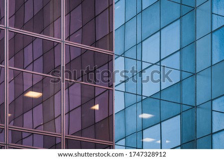 Reflections on the corner of the glass facade of an office building