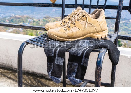 Tourist Hiking shoes with socks. Trekking and Hiking, travel and tourism concept. Close-up stock photo.