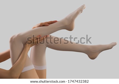 Compression stockings in grey background