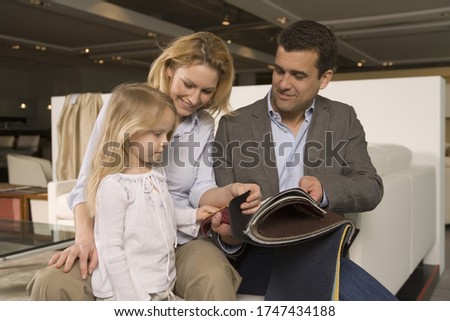 Family looking at fabric swatches