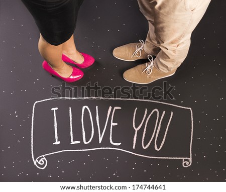 Simple love concept with feet and chalk drawn symbols. Happy valentines card.