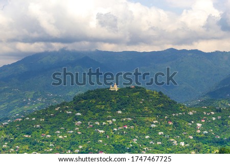 Top view of the mountains of the Caucasus. At the top of the mountain is the Orthodox Church. Place for text, design postcard, calendar or poster. Autonomous Republic of Adjara, Georgia, Eurasia.