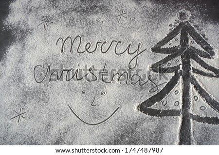 merry christmas, smiles and christmas tree on snowy background                               