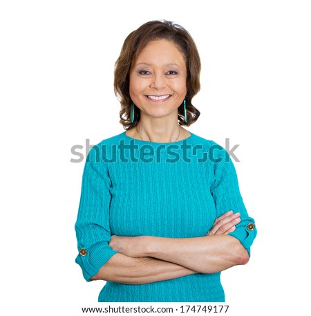 Closeup portrait of happy smiling amiable mirthful successful pretty senior mature woman in aqua sweater with arms crossed, isolated on white background. Positive emotion facial expression feelings.