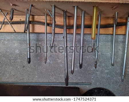 many different screwdrivers with different slots in the garage