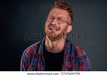 Indoor shot of gloomy and upset redhead mature man with beard, tilting head behind, frowning and grimacing, complaining to friend on bad life, whining or crying heart out in despair. Royalty-Free Stock Photo #1747604798
