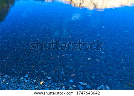 Reflection of Laurel Mountain and Granite Stones on The Bottom of Convict Lake, Mammoth Lakes, California, USA