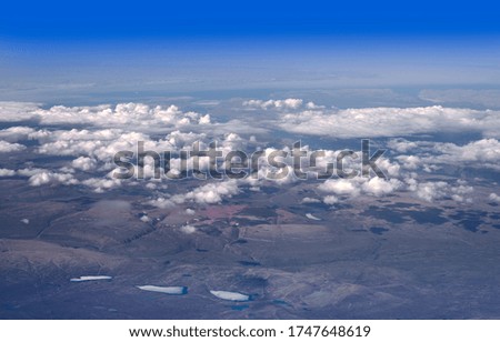 Baffin Bay sea and Greenland coastal mountains with clouds